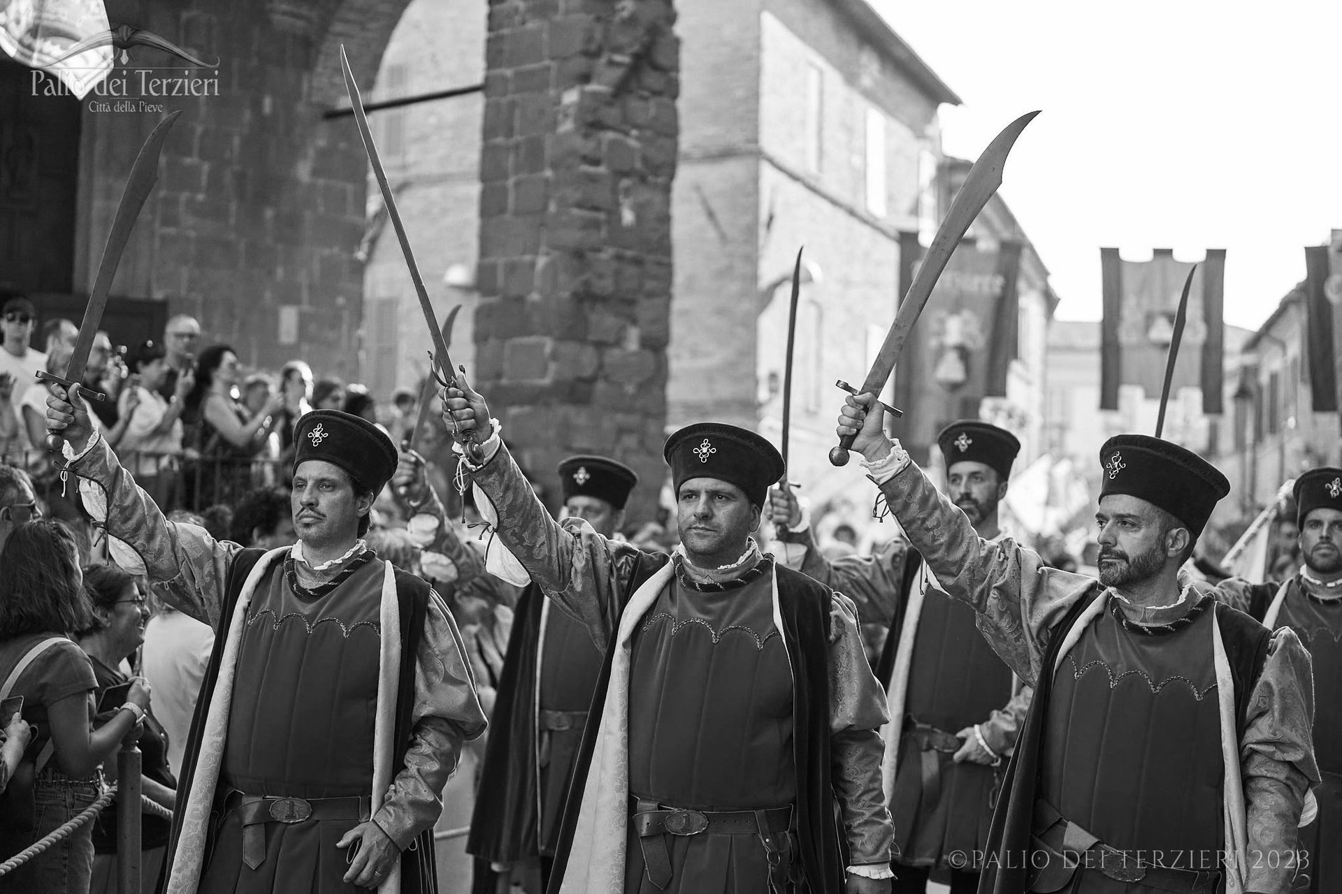 Men-at-arms in the procession with sabres