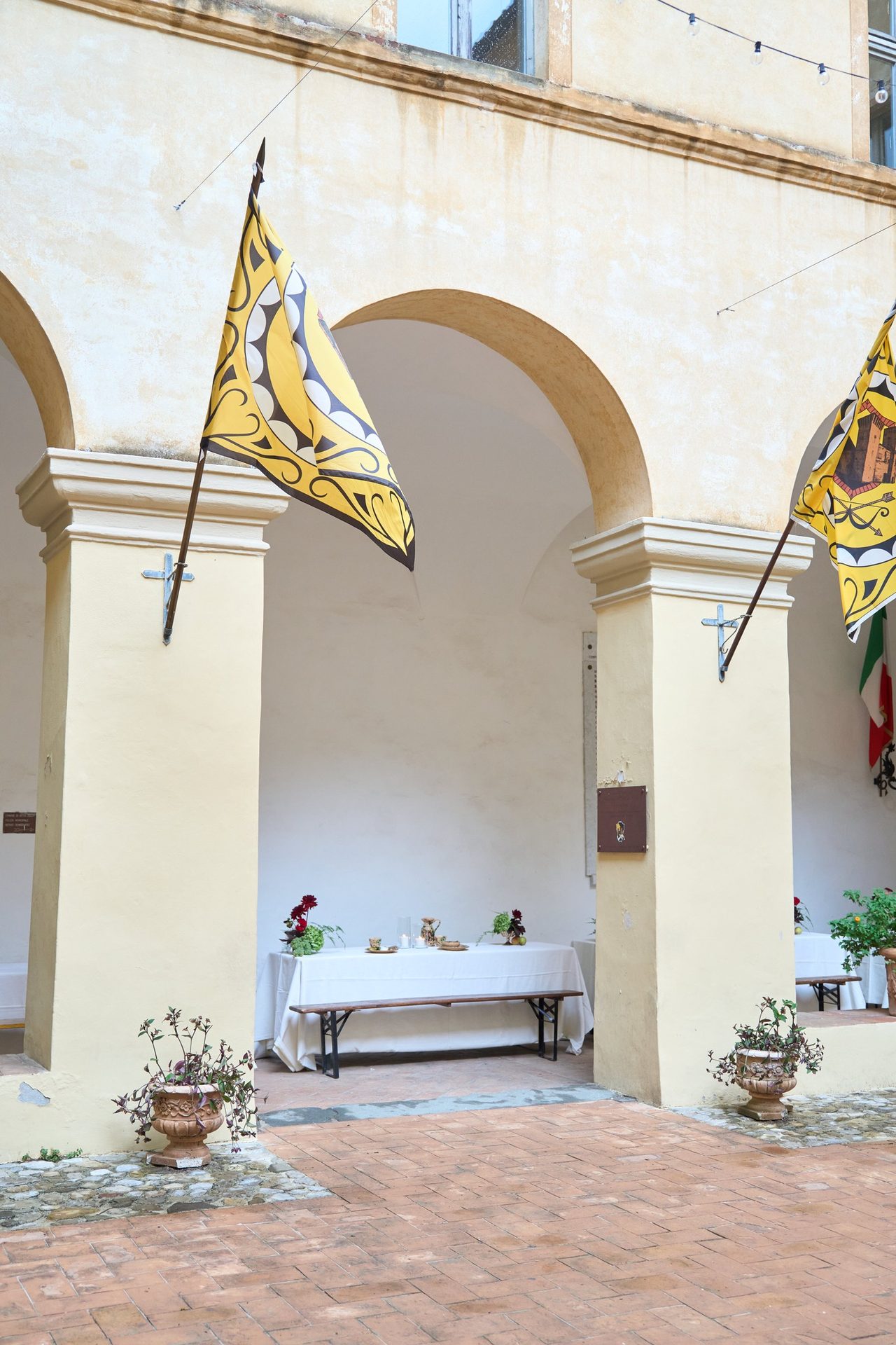 Borgo courtyard with standards