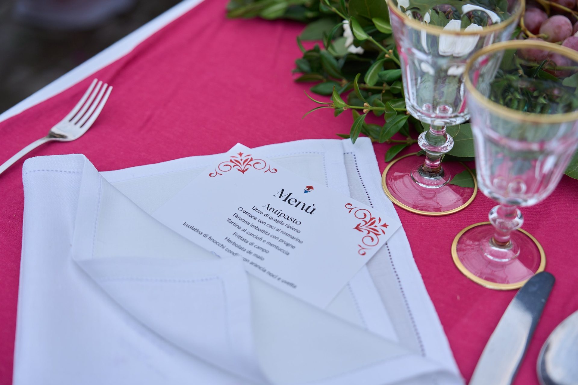 Place setting on a red tablecloth